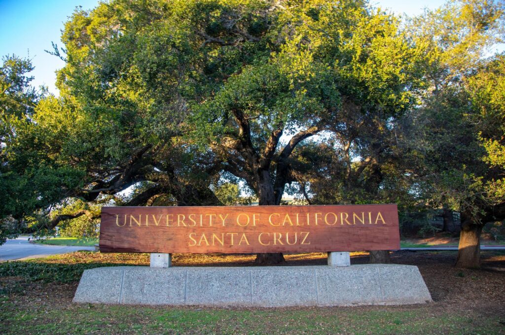 Monument sign at base of campus that reads University of California Santa Cruz