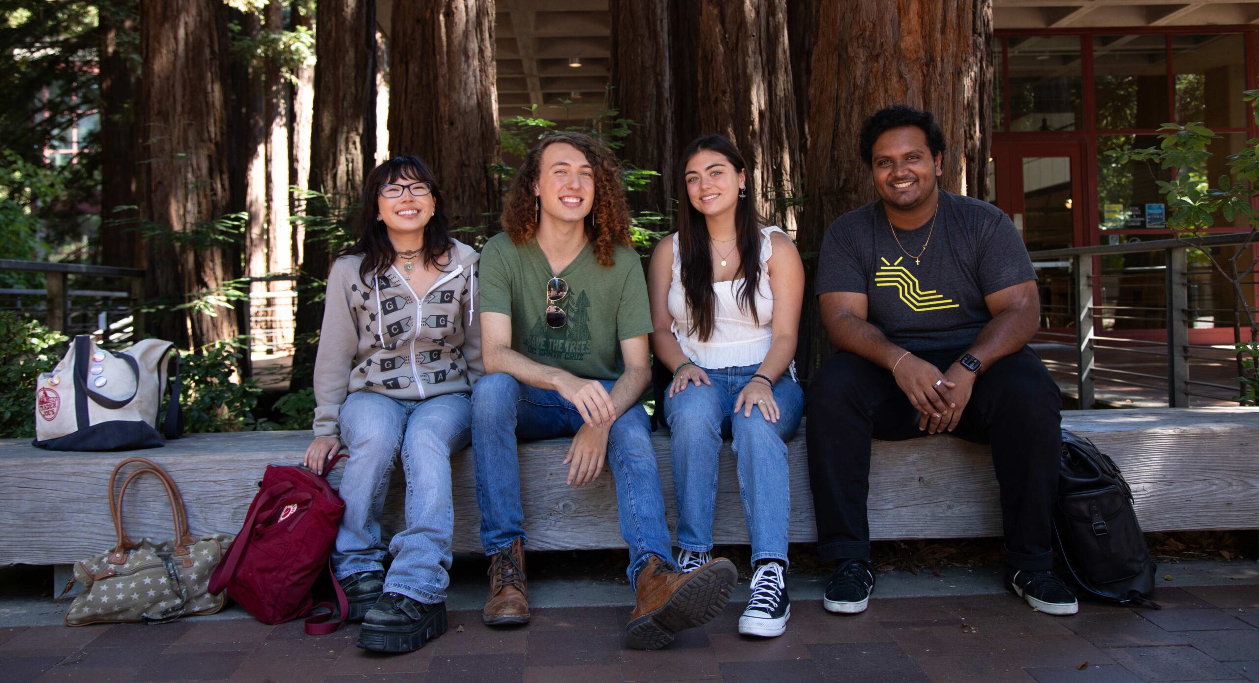 Students sat together on wooden bench